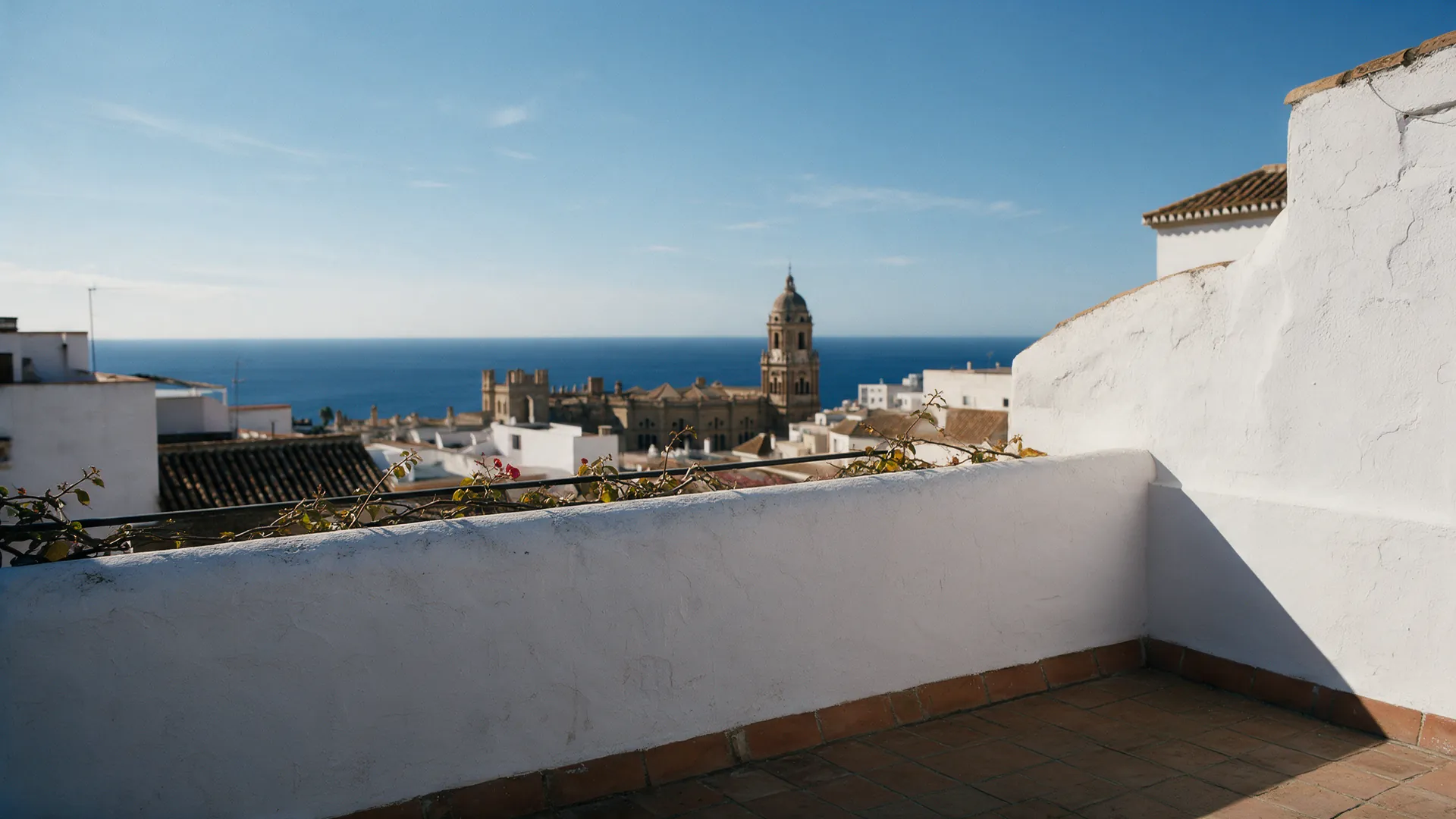 The terrace on a clear winter morning, sea and cathedral behind.